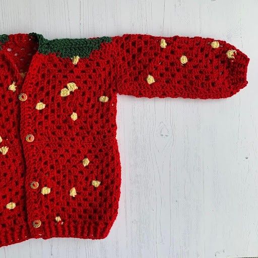

Strawberry - Lasten neuletakki
4